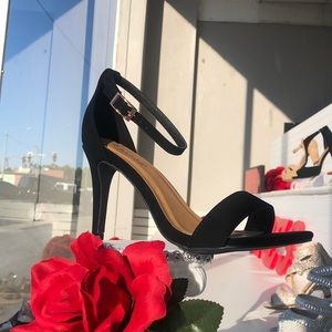 Black strappy sandals - heels.
